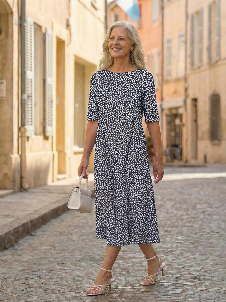 Blue women's coastal pattern midi dress with three-quarter sleeves for comfortable, casual summer wear.