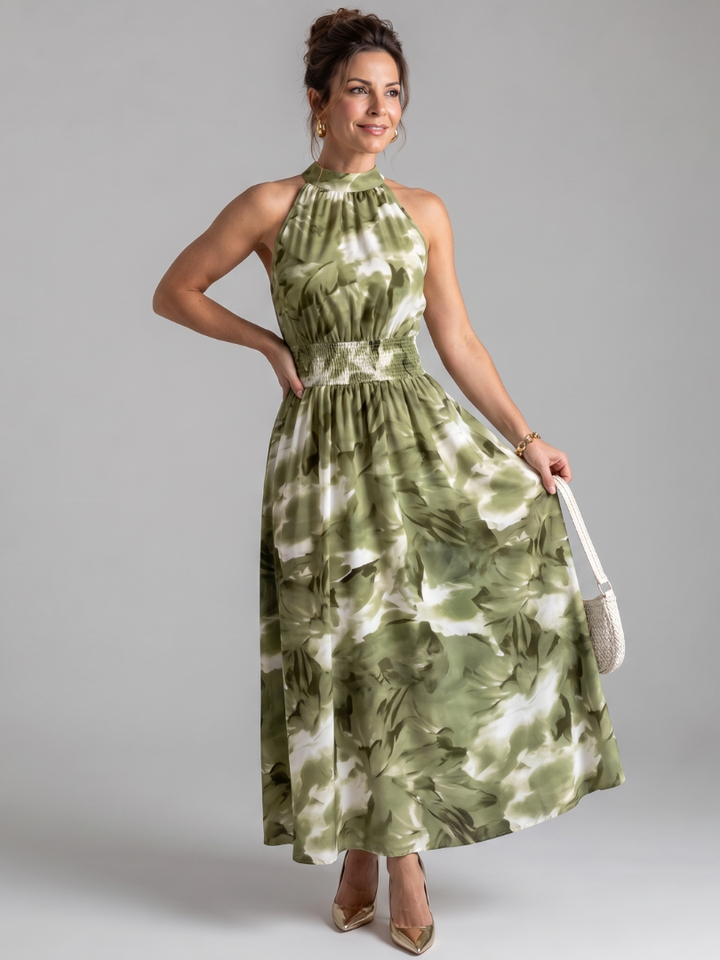 Women's elegant gathered waist abstract print midi dress. Flowy summer style, perfect for vacation wear.