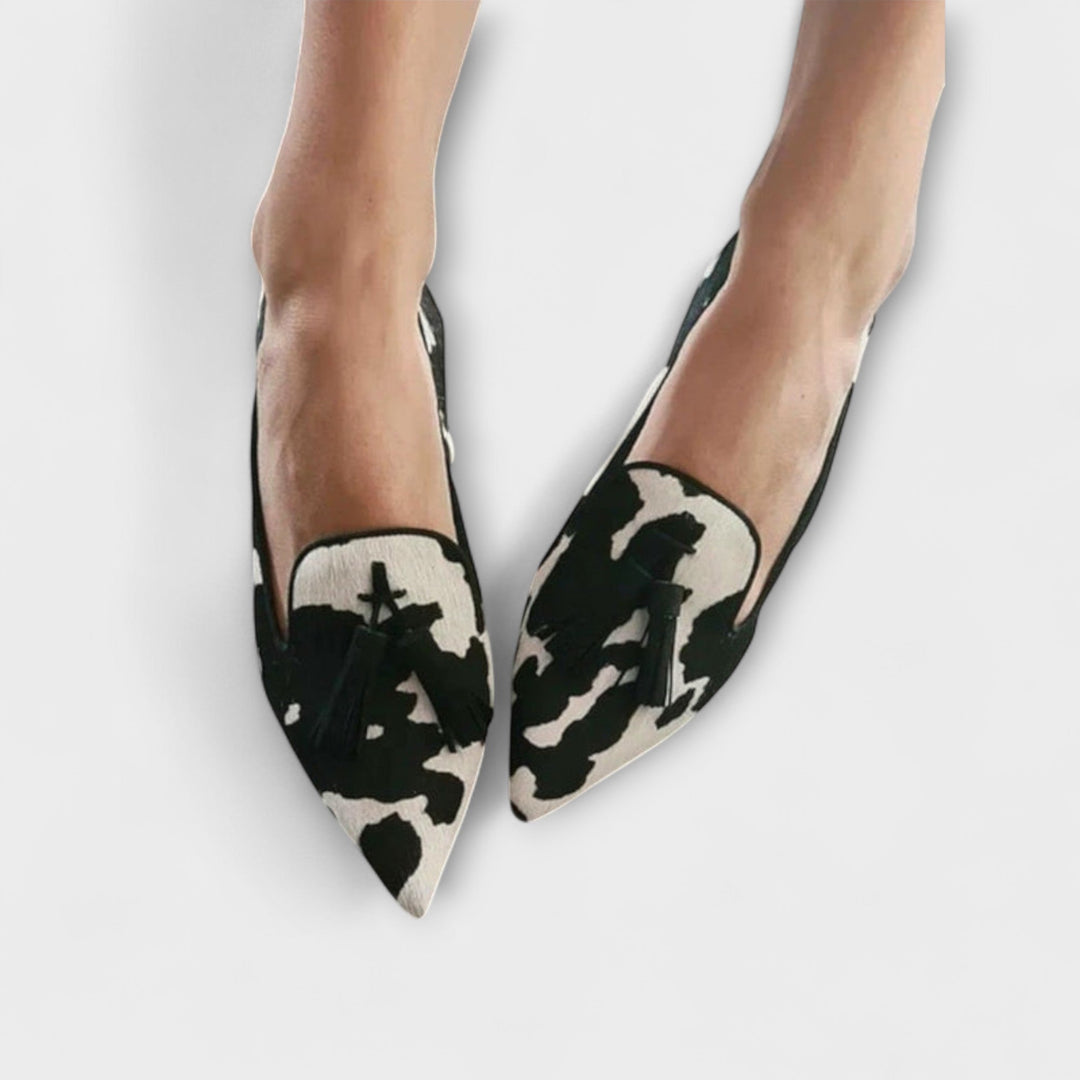 Comfortable women's slip-on tassel loafers. Chic pointed toe footwear for casual, everyday, or dressy style.