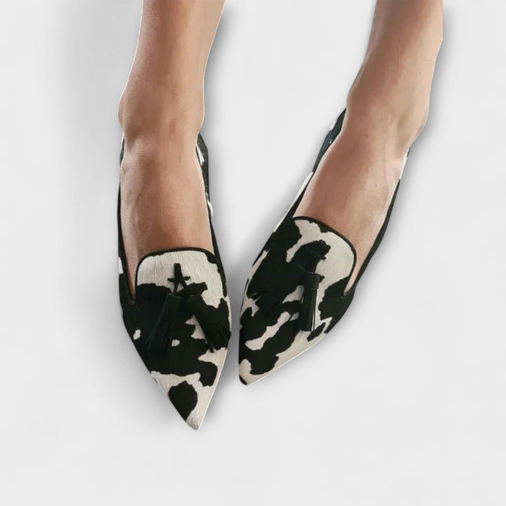 Comfortable women's slip-on tassel loafers. Chic pointed toe footwear for casual, everyday, or dressy style.