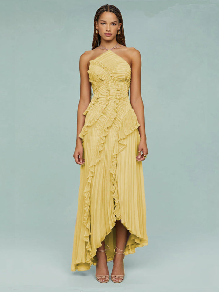 Sophisticated sleeveless pleated maxi wedding guest dress with a trendy asymmetric hem.