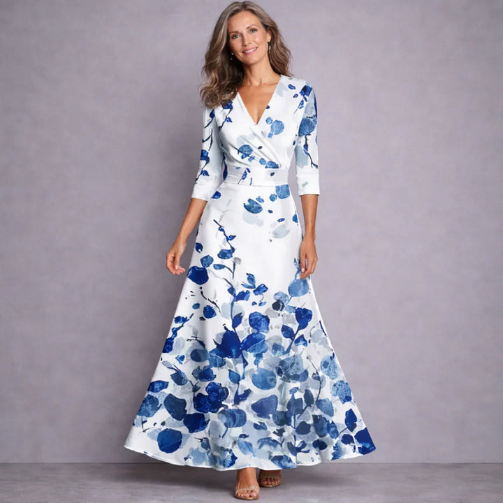 Elegant women's mid-sleeve maxi dress in a flowing fabric, perfect for summer occasions and comfortable wear.