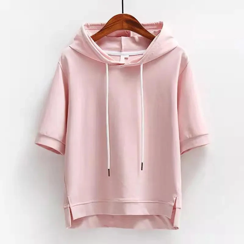 Modern women's boxy fit short-sleeve hoodie. Versatile cotton blend top for spring & summer casual fashion.