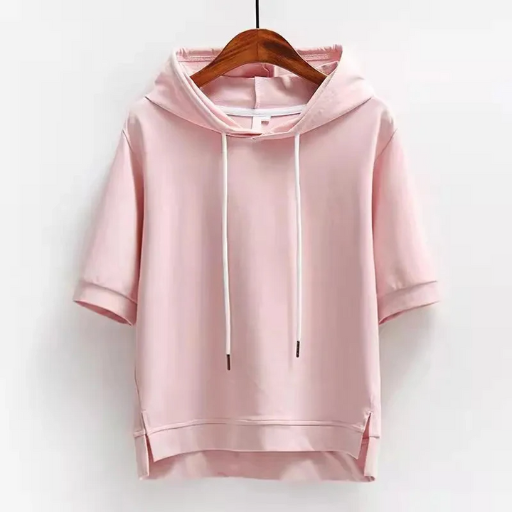 Modern women's boxy fit short-sleeve hoodie. Versatile cotton blend top for spring & summer casual fashion.