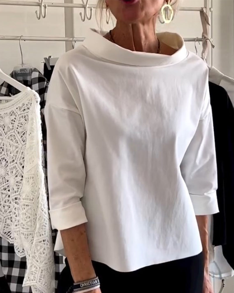 Chic women's collared shirt with 3/4 sleeves, a versatile blouse for office or casual spring looks.