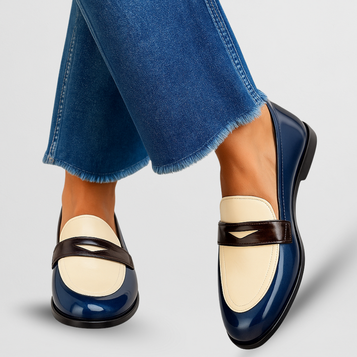 Chic two-tone slip-on loafers for women, perfect for comfortable everyday style or dress shoes.