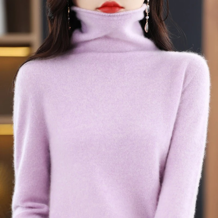 Women's soft roll neck sweater. Cozy long sleeve pullover for warm, stylish comfort.