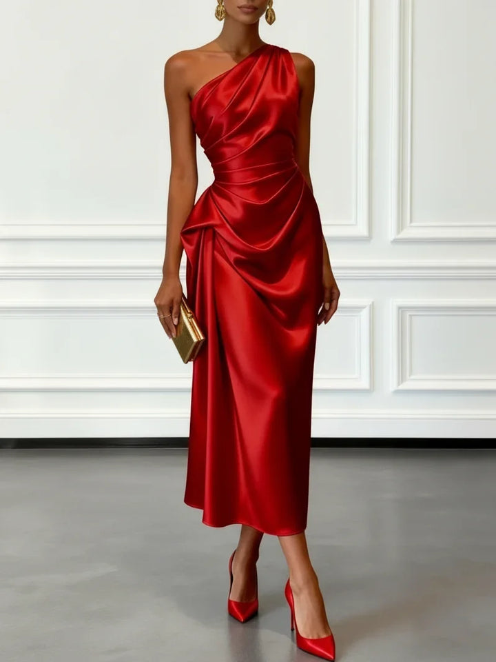 Fashionable women's party dress: one-shoulder, ruffled midi style. Great for special occasions.