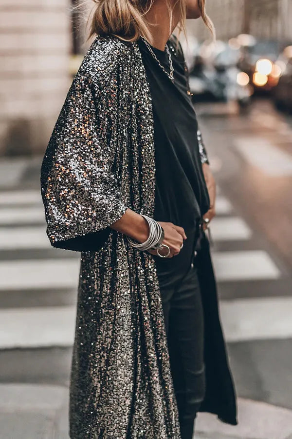 Luxurious women's sequined kimono with bell sleeves and keyhole. Dazzling and glamorous for any celebration.