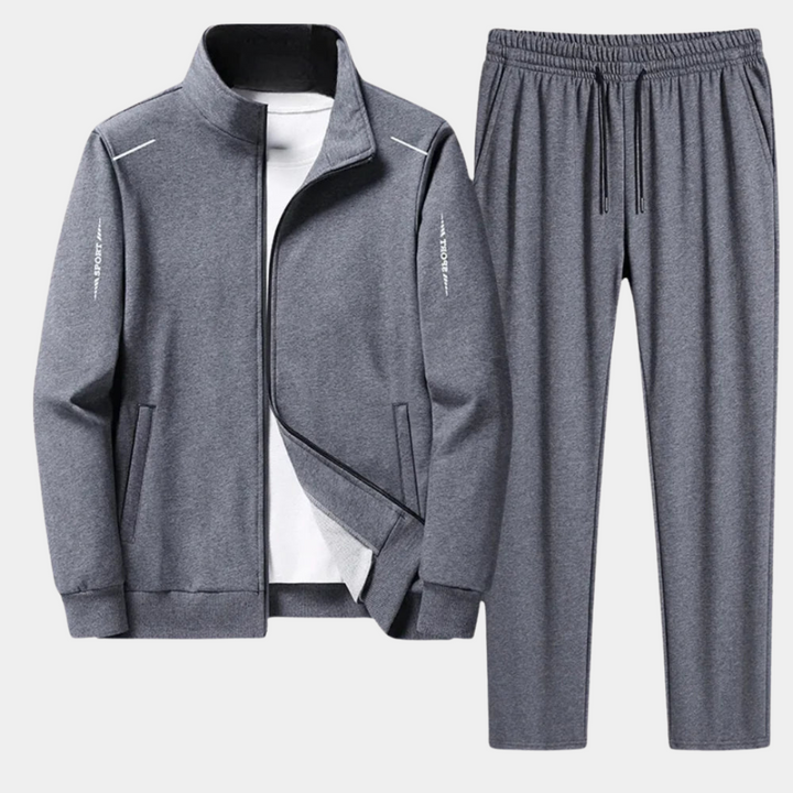Premium men's tracksuit set. Soft hoodie and flexible sweatpants deliver comfort and style for active or casual fashion.