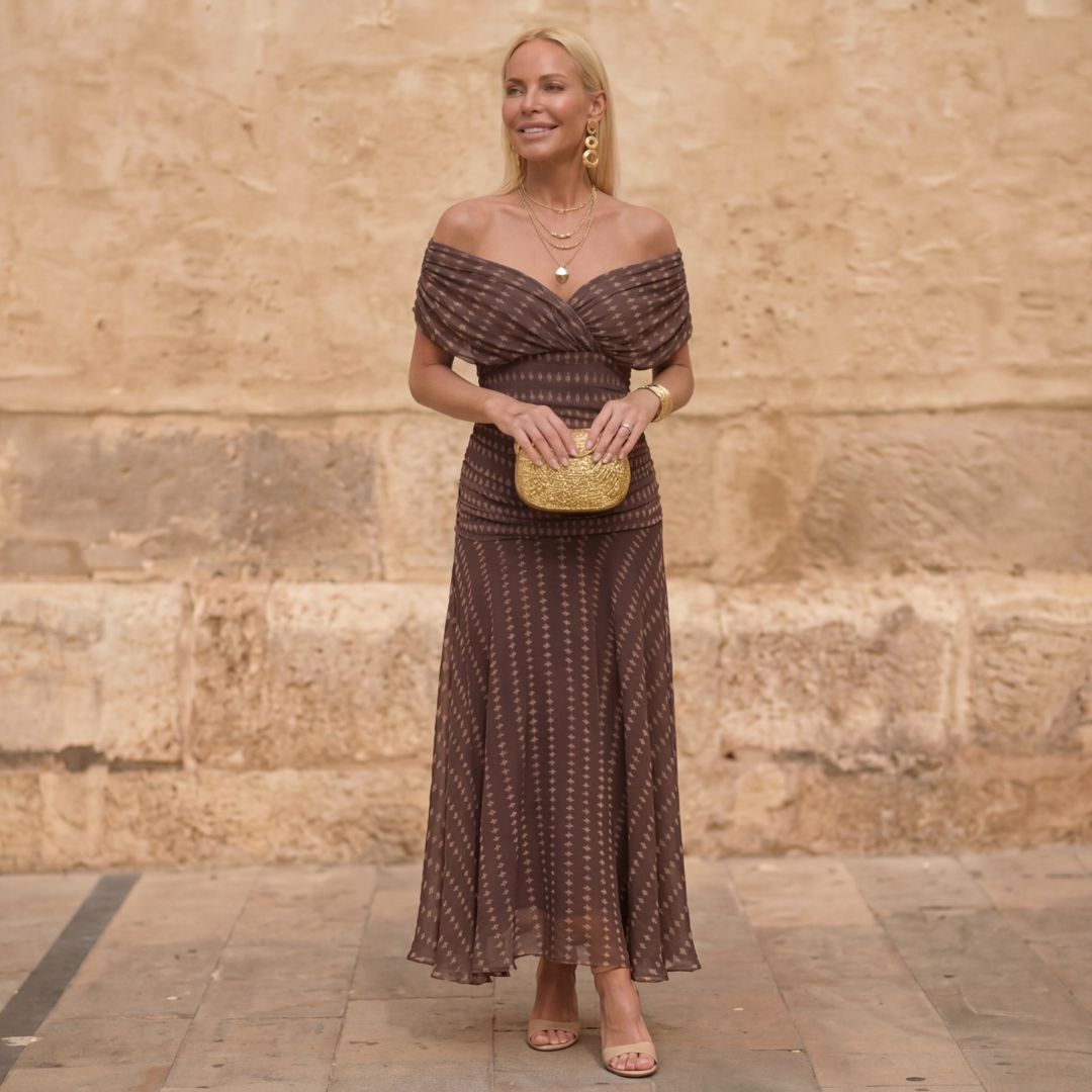 Elegant brown women's off-shoulder flowing midi dress, perfect for sophisticated party or evening occasion wear.