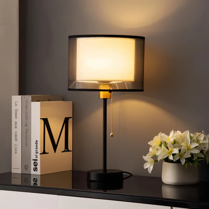 Decorative vintage table lamp with elegant double fabric shade, providing cozy warm ambient LED light for home decor.