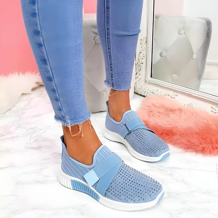 Women's slip-on trainers with elastic strap, lightweight design for casual or athletic wear. Comfort walking shoes.
