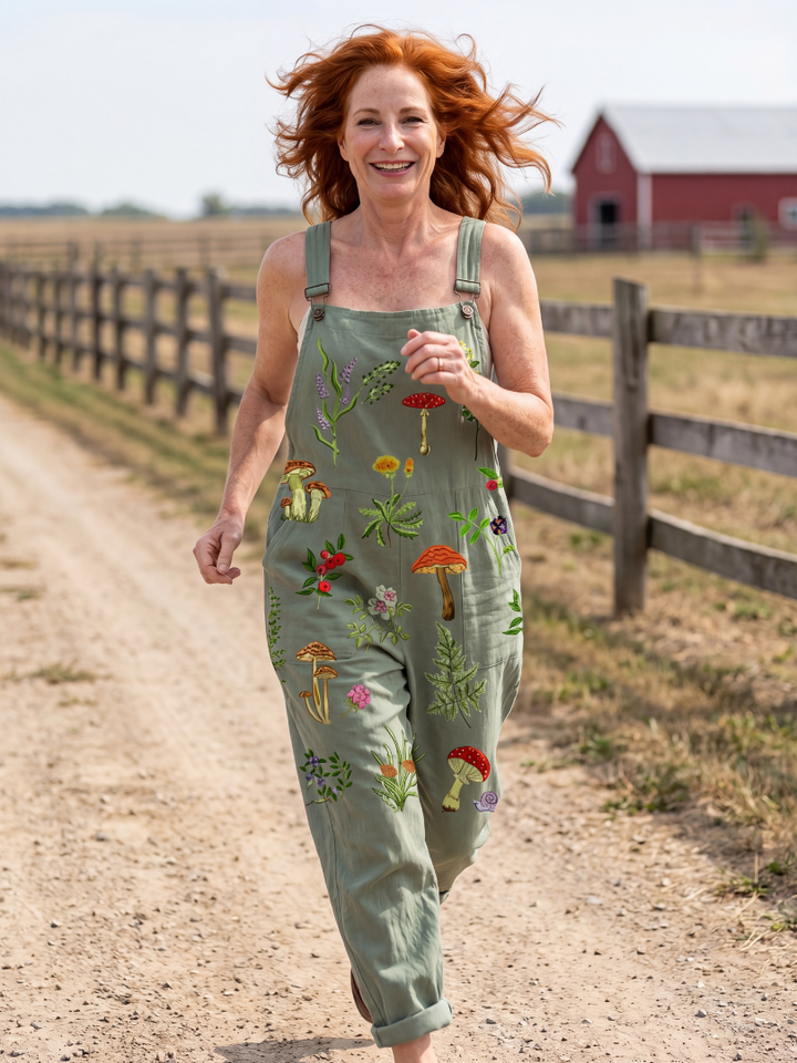 Women's relaxed fit sage green field strap jumpsuit with wide legs, ideal for casual spring & summer outdoor wear.