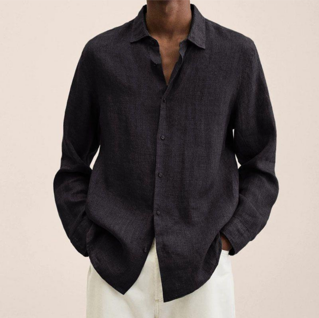 Dark grey men's long-sleeve button-up shirt, an elegant and versatile top for various occasions.
