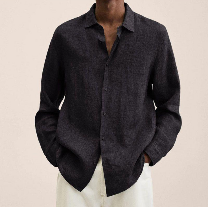 Dark grey men's long-sleeve button-up shirt, an elegant and versatile top for various occasions.