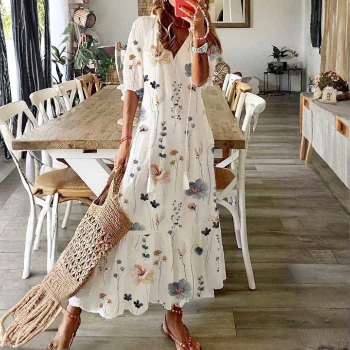 Women's boho floral print maxi dress with short sleeves, perfect for summer casual wear or a beach vacation.