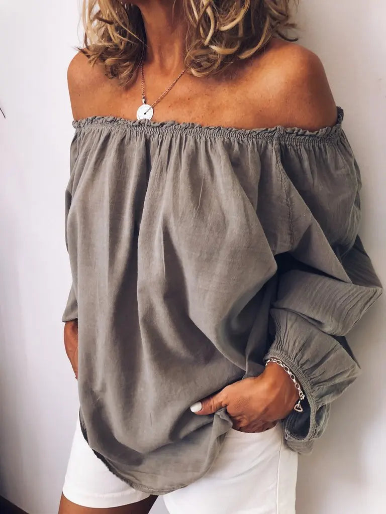 Elegant women's off-shoulder blouse with chic balloon sleeves, perfect for versatile fashion.