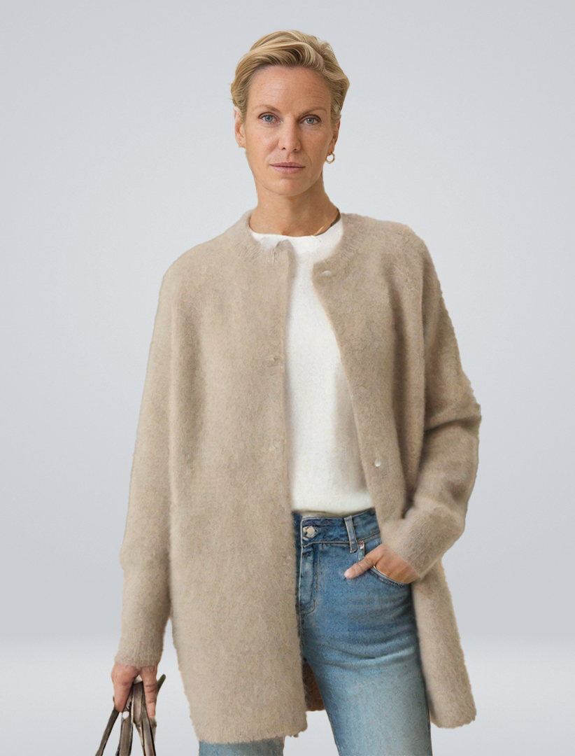 Women's minimalist longline button cardigan, an elegant layering piece for versatile autumn outfits.
