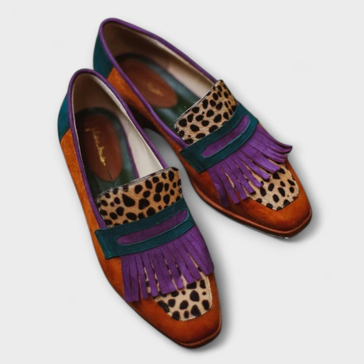 Women's polished brown leather loafers, elegant and comfortable, perfect for both formal and casual everyday wear.