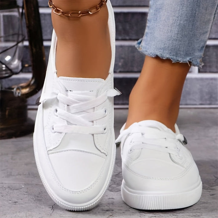 Comfortable white women's walking shoes with orthopaedic design & foot pain relief.