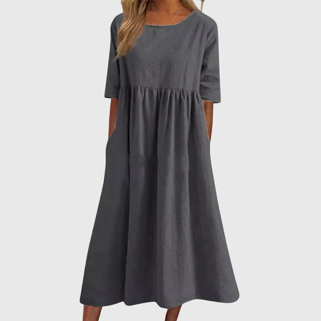 Chic women's short sleeve midi dress, featuring an elegant midi length and versatile design for day to night.