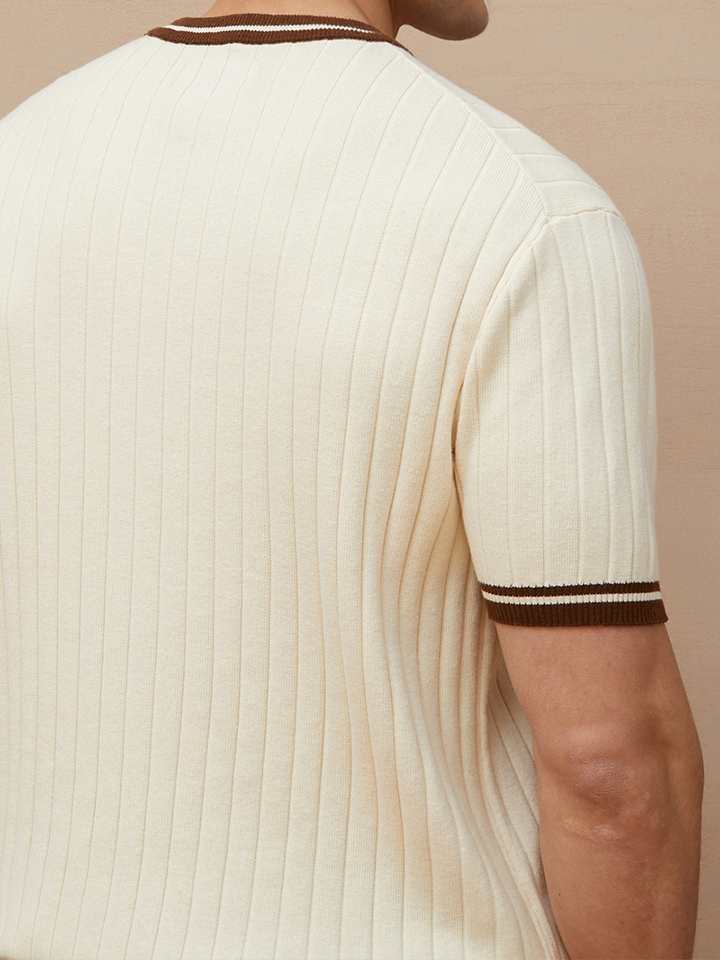 Stylish men's short-sleeve polo, ribbed knit fabric, classic beige, accented with striped collar and cuffs.