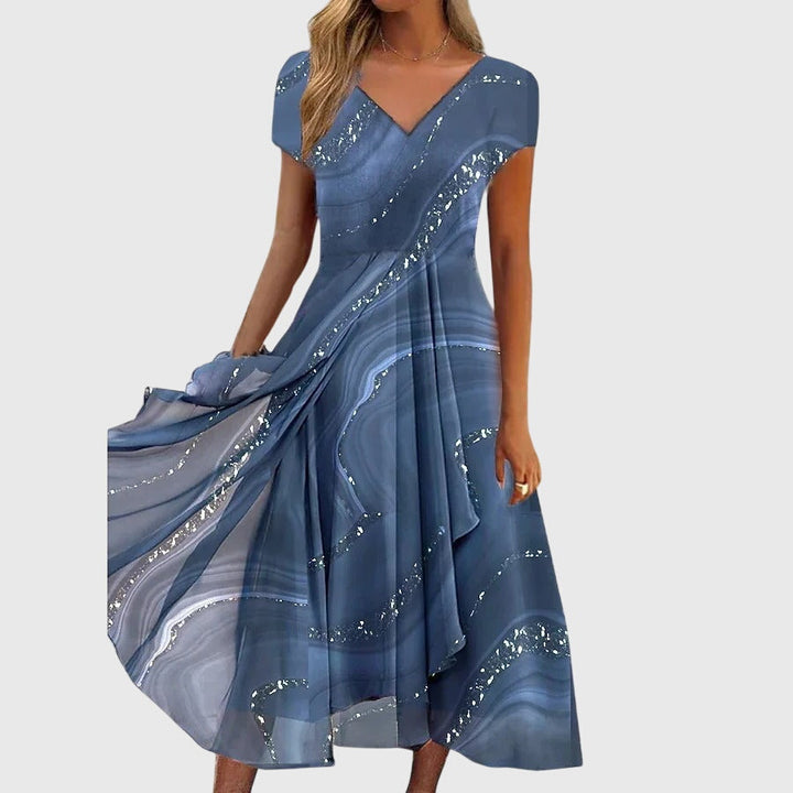 Elegant women's flowing midi dress with V-neckline, perfect for summer parties or versatile casual wear.
