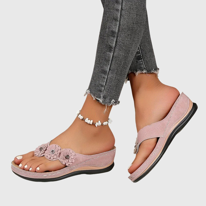 Lightweight women's flip flops with ergonomic arch support, essential for comfortable summer days.