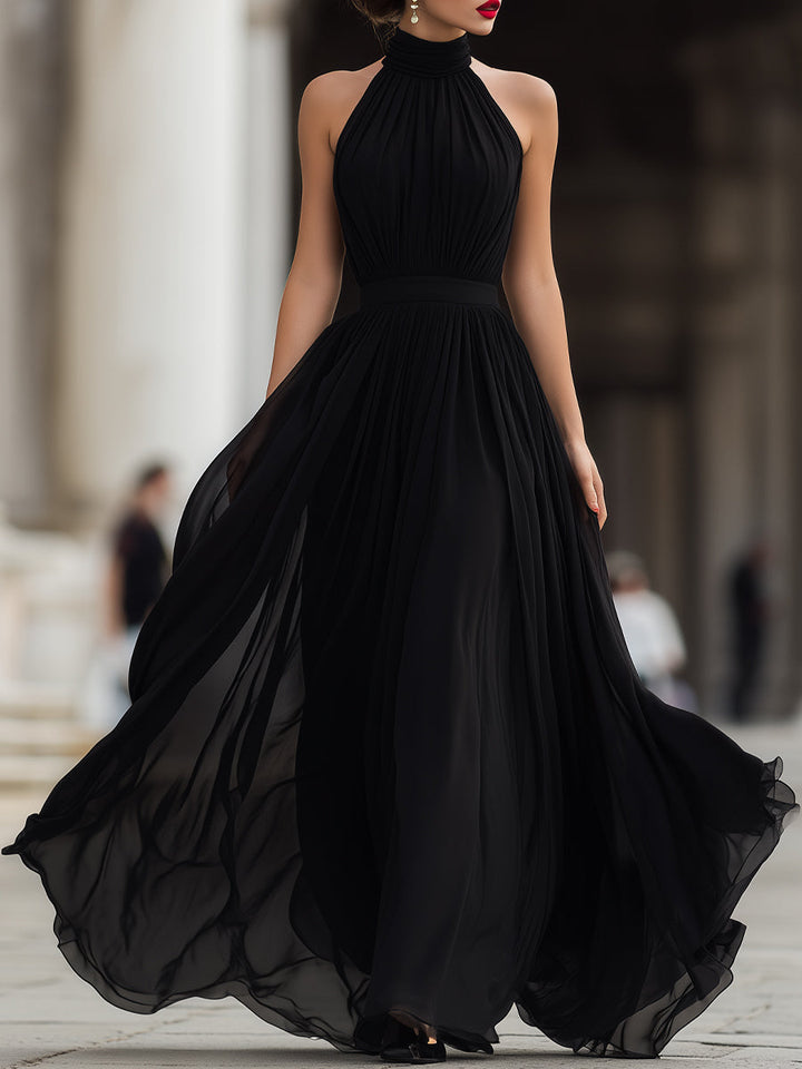 Floor-length pleated halter neck maxi dress for women, ideal for special occasions & cocktail parties.