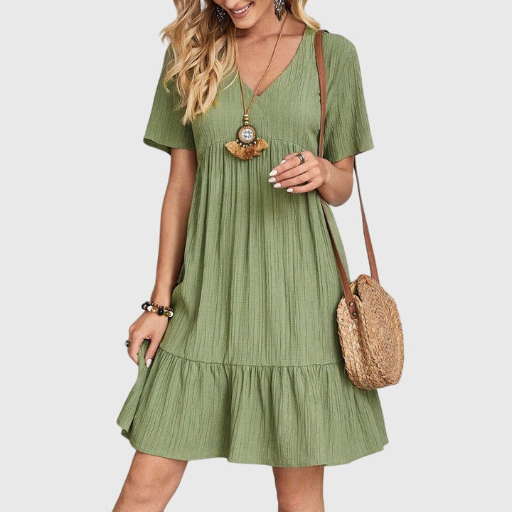 Flattering short sleeve midi dress for women. Elegant design with a comfortable fit, versatile for day or evening wear.