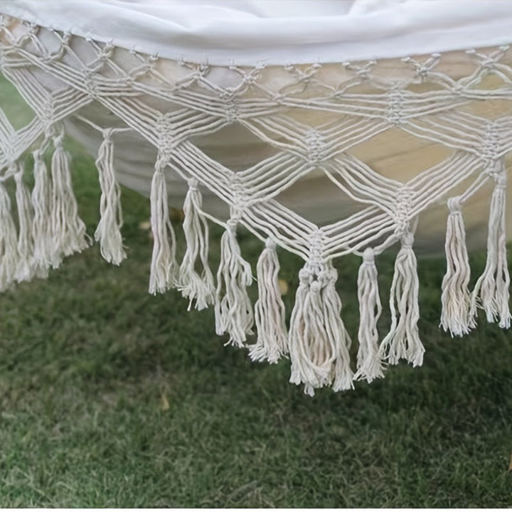 Stylish unisex bohemian hammock, colorful stripes, tassels for indoor/outdoor relaxation.
