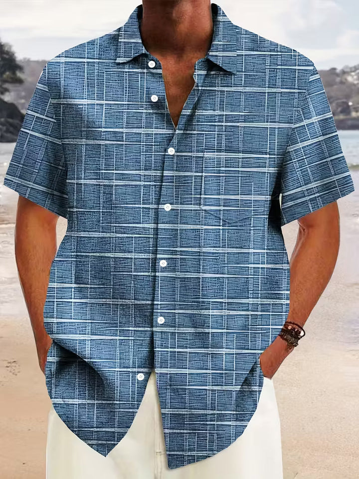 Stylish men's blue short sleeve button shirt for summer. Casual menswear, great for travel, beach, or relaxed wear.