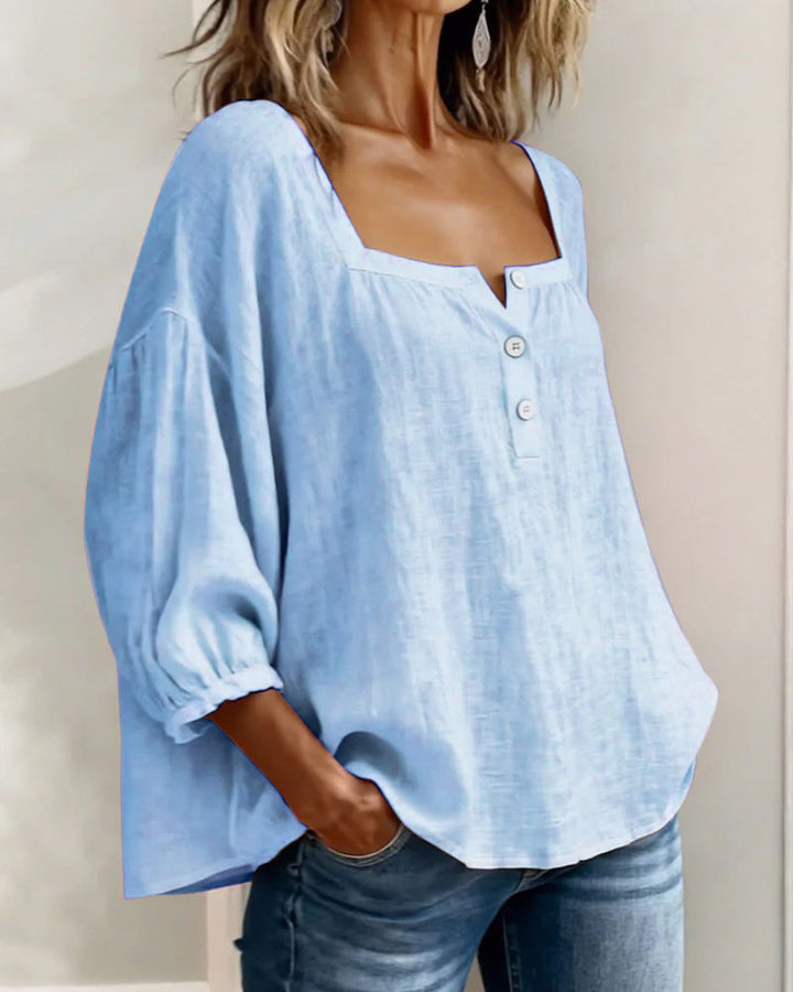 Stylish relaxed women's top, featuring puff sleeves & a sophisticated square neck.