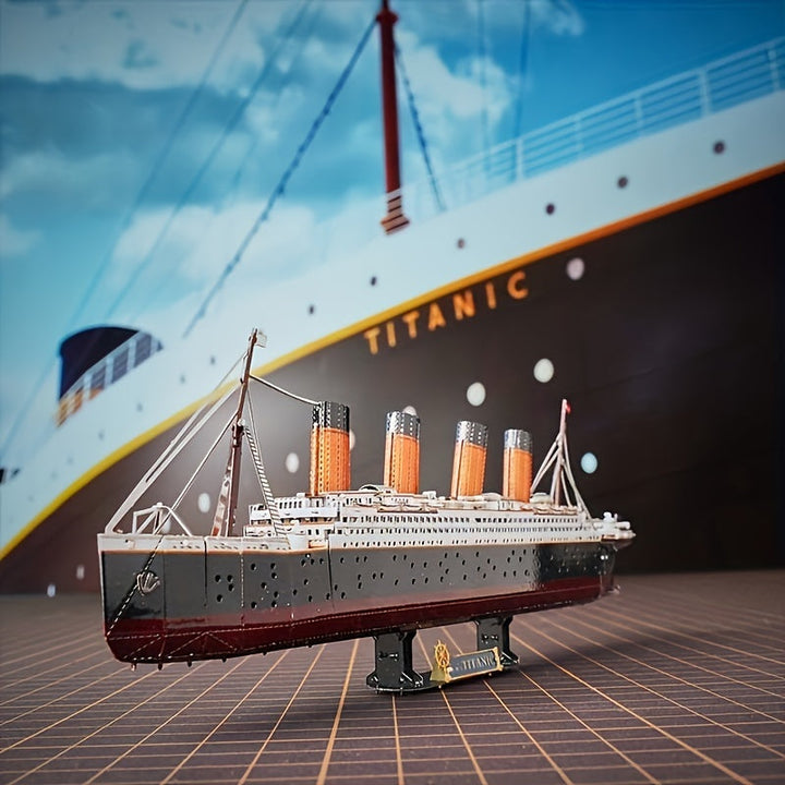 Finished Titanic 3D metal ship model displayed on a desk, elegant decor and a testament to an intricate DIY craft project.