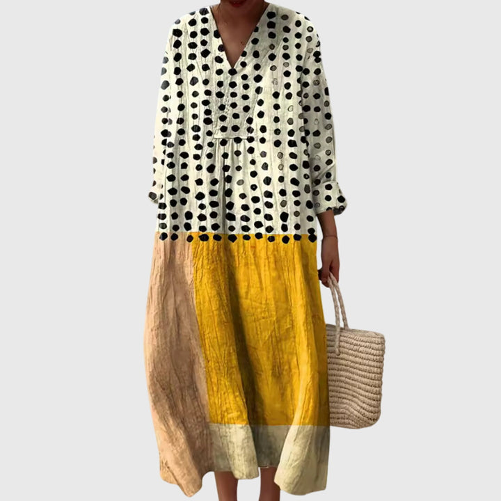Elegant geometric print maxi dress for women, offering versatile style from day to evening. Modern fashion.