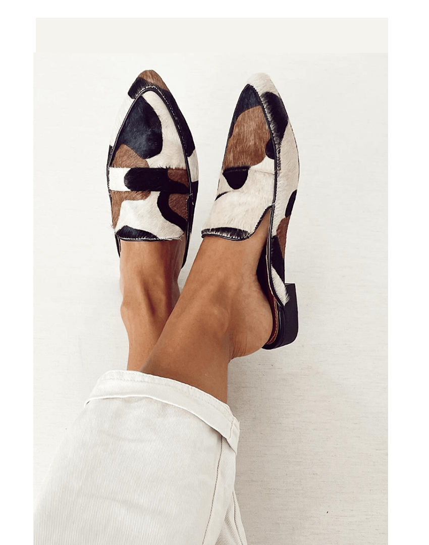 Women's patterned slip-on loafers with a comfortable flat sole, perfect for casual or office wear. Stylish everyday flats.