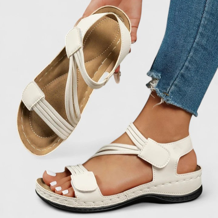 Supportive women's sandals with arch support for foot pain relief and comfortable walking.