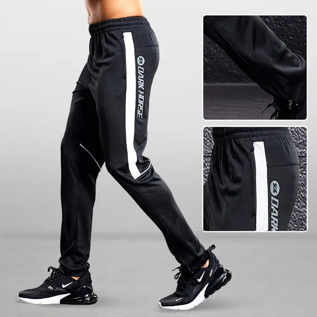 Comfortable men's performance joggers with lightweight fabric, tapered fit, and zipper pockets for active lifestyles.