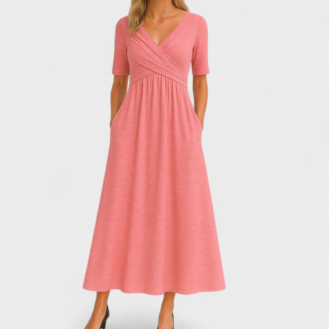 Chic women's V-neck midi dress in grey, featuring a comfortable fit and essential pockets for daily style.