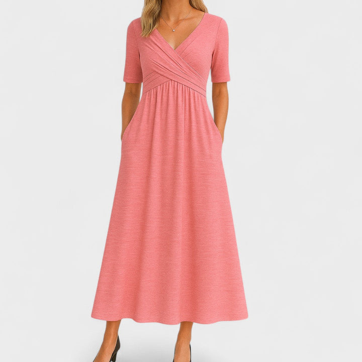 Chic women's V-neck midi dress in grey, featuring a comfortable fit and essential pockets for daily style.
