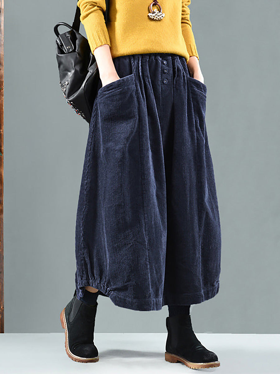Elegant women's flowy pleated skirt with button-down front & discreet side pockets, suitable for work or leisure.