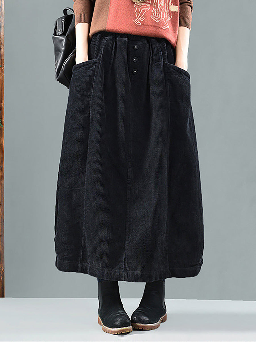 Women's maxi pleated skirt with front buttons & pockets, offering a comfortable, flowy fit for versatile styling.