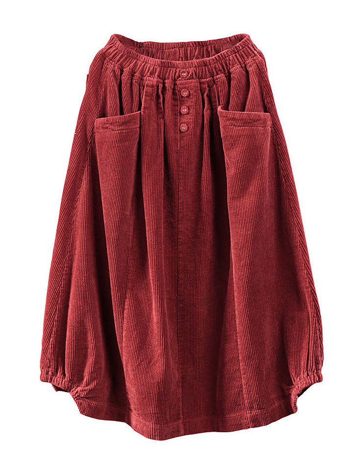 Chic women's flowy pleated maxi skirt featuring a button detail and convenient pockets, great for casual or work.