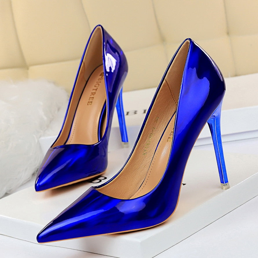 Women's elegant black pointed toe stiletto high heels for formal events.