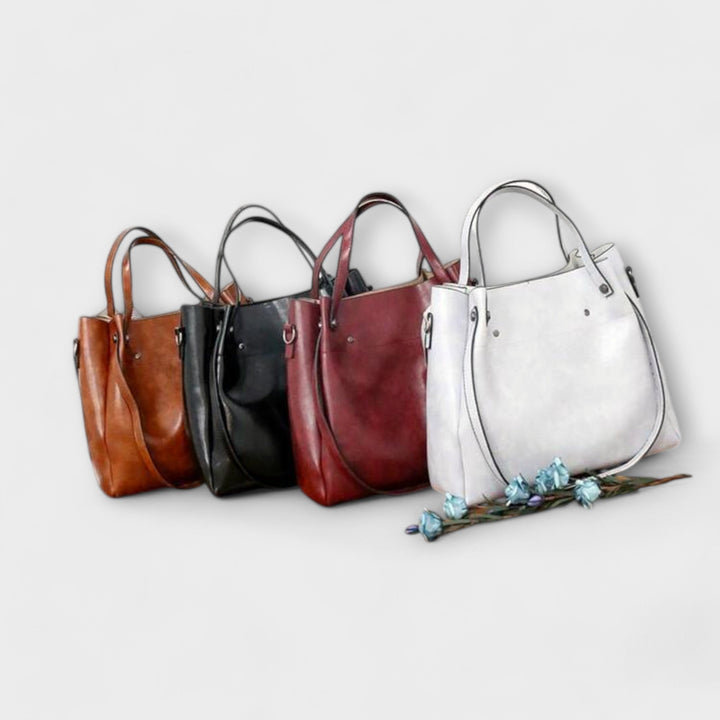Gray classic vintage women's handbag accessory set. Tote, shoulder bag, small purse included.