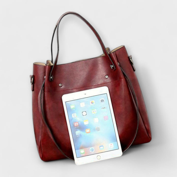 Fashionable red vintage style women's handbag set. Tote, cross-body bag, clutch, and card holder.