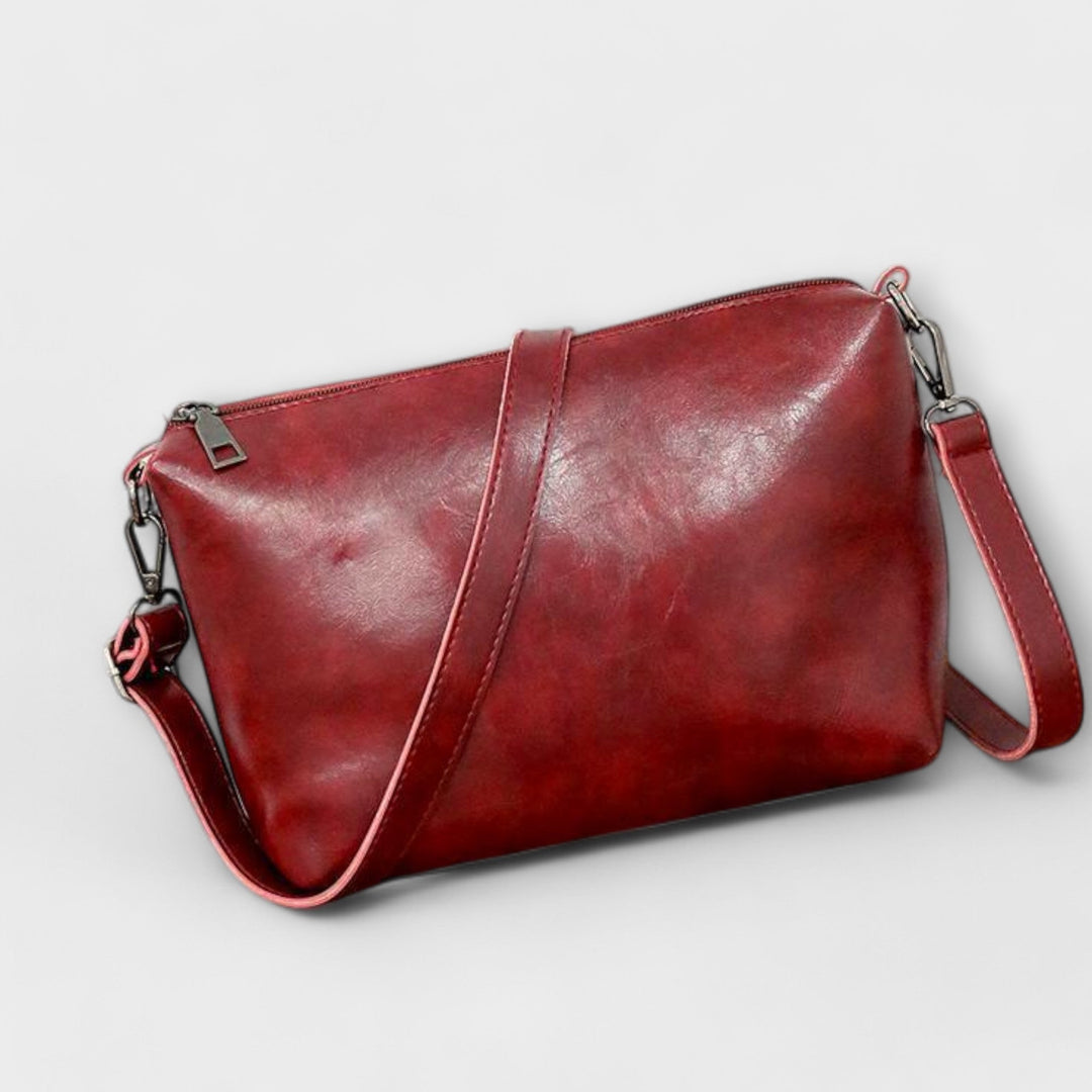 Gray fashionable vintage style women's handbag set with a large tote, shoulder bag, and wallet.