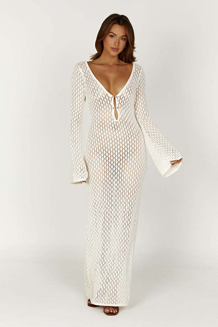 Women's elegant white maxi dress with flowing wide sleeves. Perfect for summer holidays & chic vacation style.