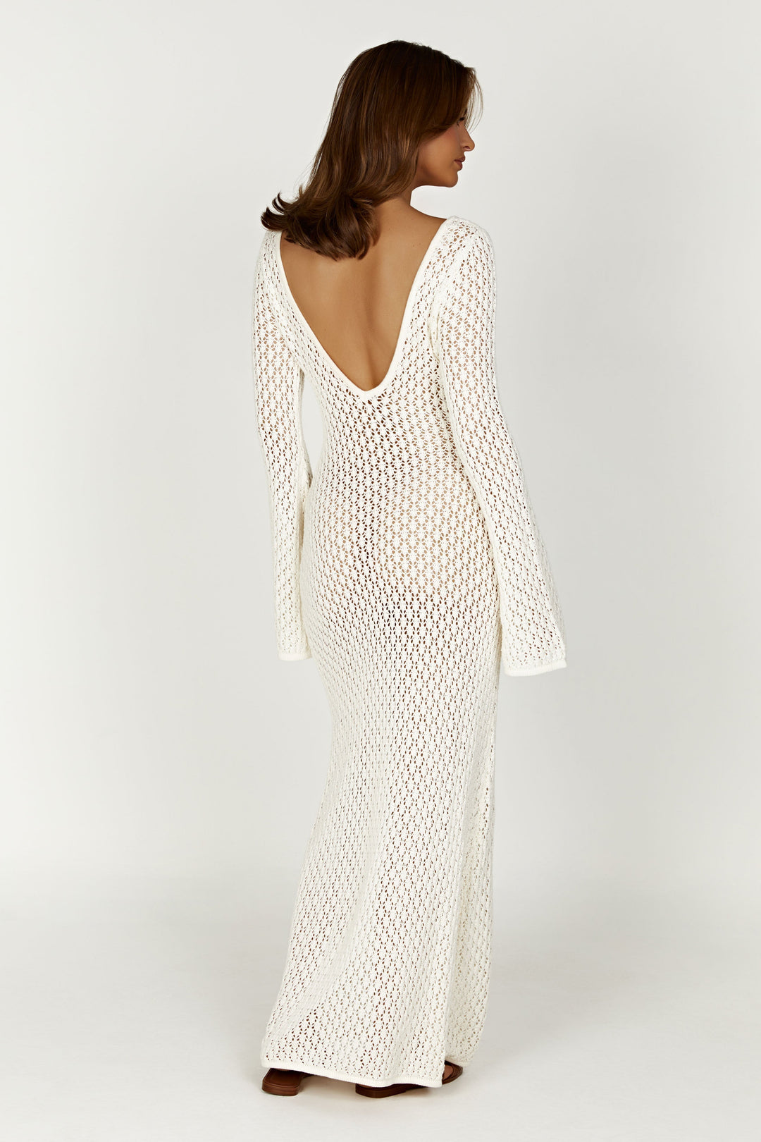 Flowing white maxi dress for women, featuring elegant wide sleeves. Perfect for holiday vibes and summer fashion.